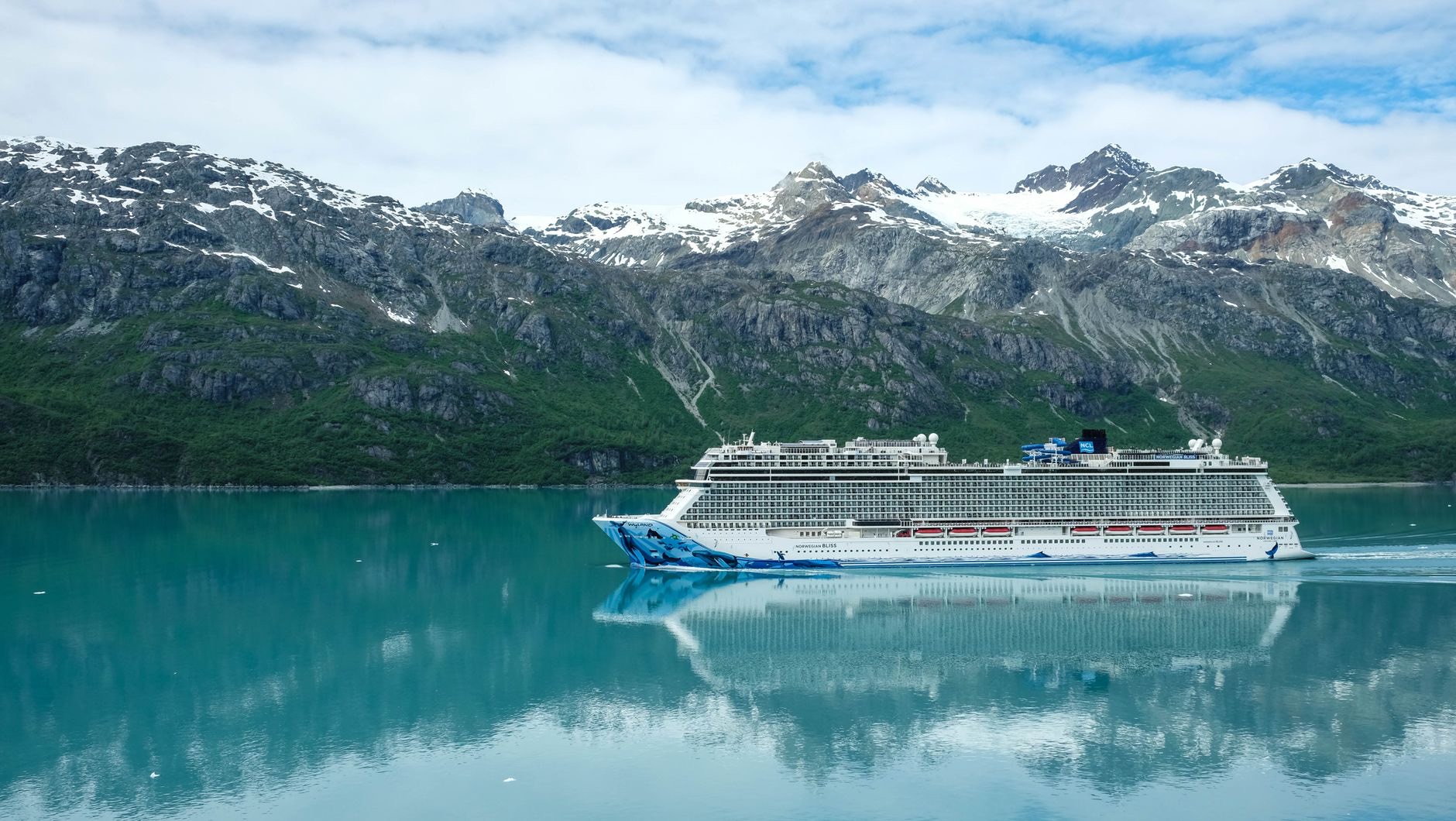 A cruise ship passing a glacier